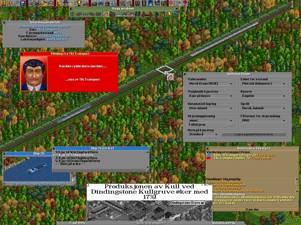 To make OpenTTD more internationally appealing, we already have over 20 translations you can choose from. In this particular screenshot the language is set to Norwegian. We can see the settings window where you can change the language amongst others (item Språk) and a failed attempt to try and sabotage a competitor’s rails.