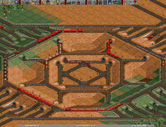 A complex four way junction in a sandy desert.